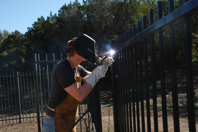 2011-12-30-Justin welds our fence-06.jpg